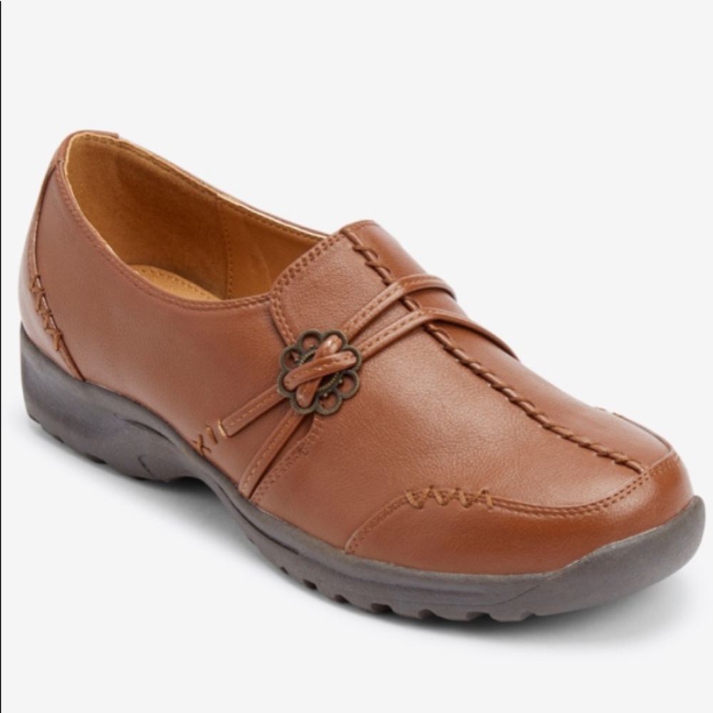 New, tried on but never worn! Leather-like slip-on cross strap. Wide width.